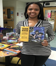 April holding a book